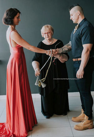 Jennifer Cram Marriage Celebrant carrying
out a Handfasting