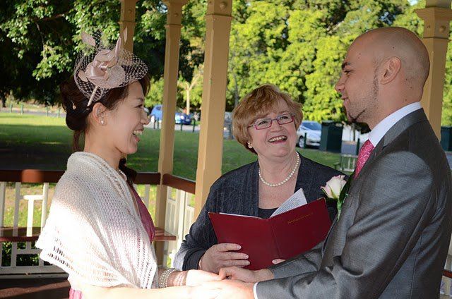 Hiromi
& Leigh sharing a happy moment with
celebrant Jennifer Cram during their Warm and
Wonderful Weekday Wedding